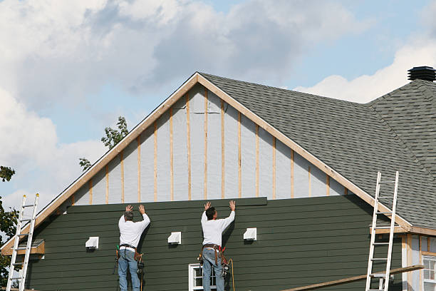 Professional Storm Damage Siding Repair technician working in Baltic, OH